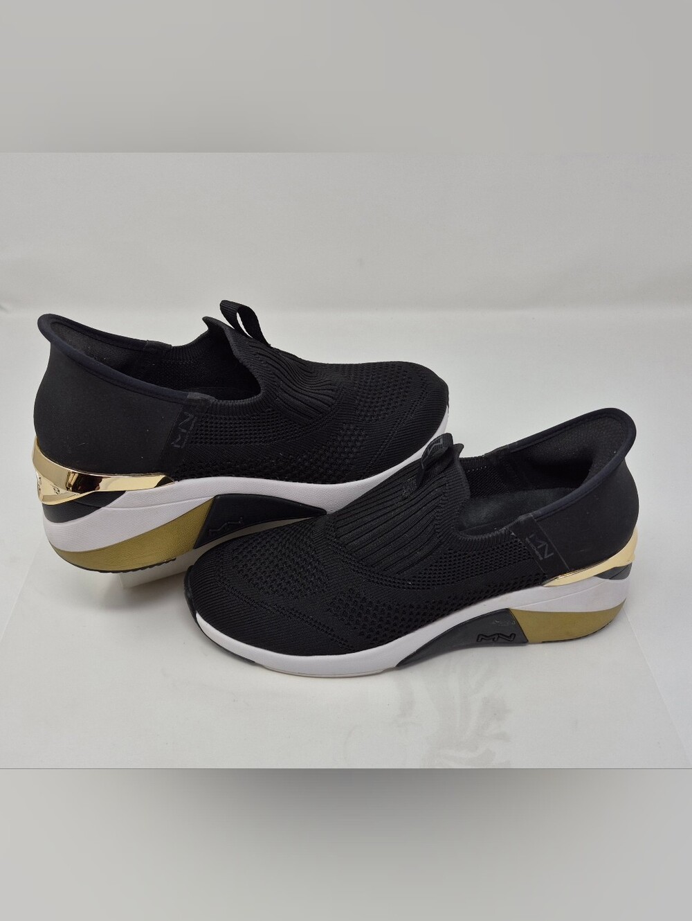 Skechers Black Slip-On Knit Sneakers with Gold Accents By Mark Nason Size 8 VGUC